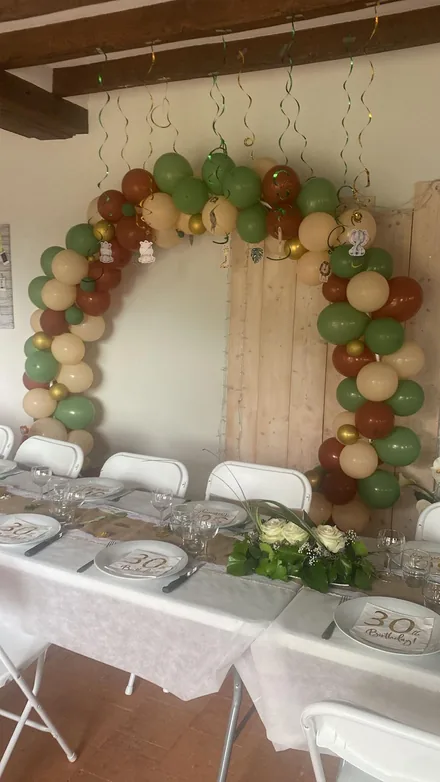 Themed balloon arch styled on-site for a celebration
