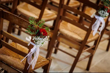 Ceremony seating with floral accents and romantic styling