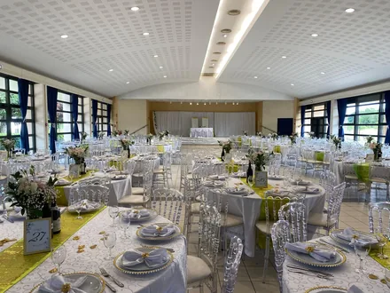 Wedding ceremony dining setup with floral centerpieces