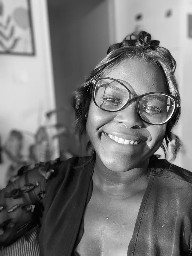 Black-and-white portrait of Madie, founder and event stylist