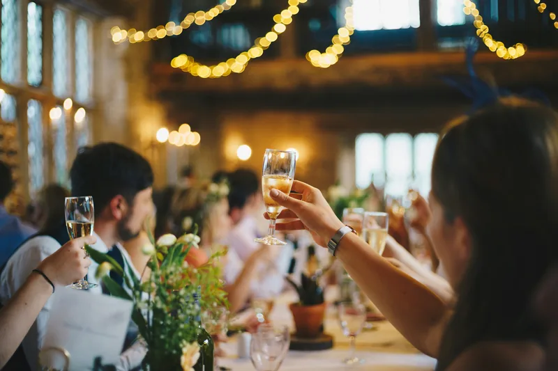 Wedding reception venue styled with tablescapes and floral accents